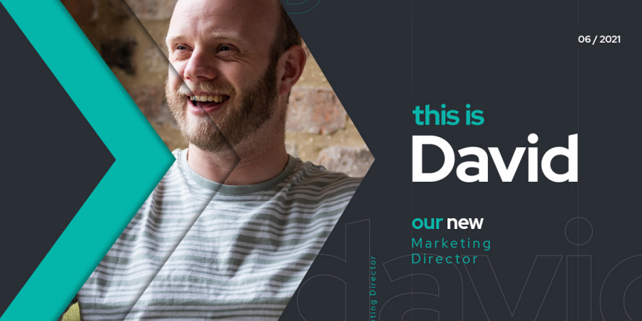 Image of David Lucas sat on a green chair smiling within the grey and teal Click branding